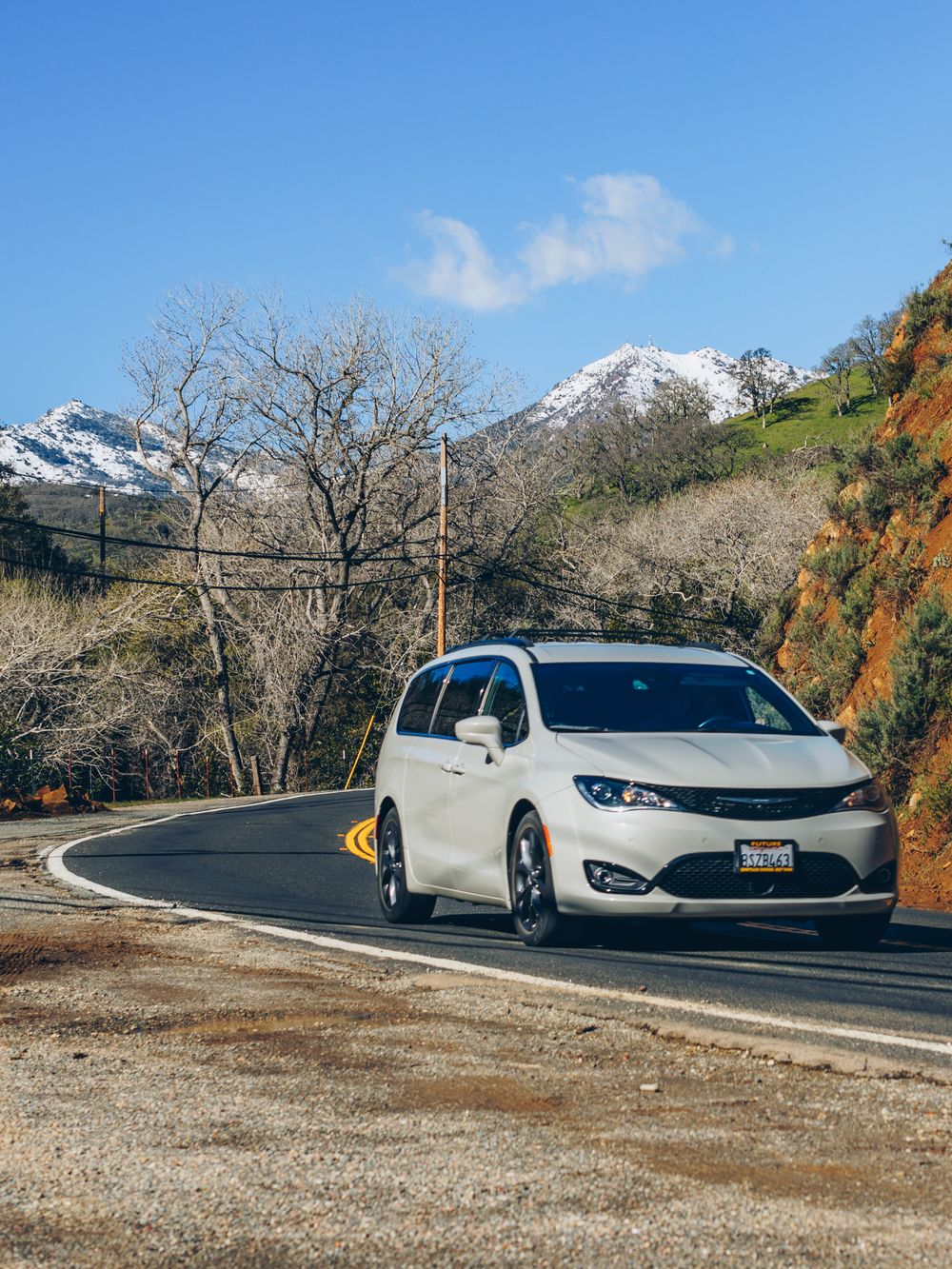 White MUV on an open road, representative of the Toyota Innova Crysta class